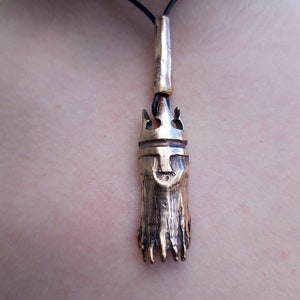 Ahti, god of depths, casted bronze pendant
