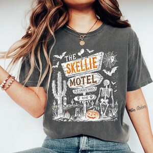 Skellie Motel (White) - Comfort Colors, Funny Skeleton Halloween Fall Shirt, Halloween Humor Vintage Shirt, Trendy Halloween Skeleton shirt