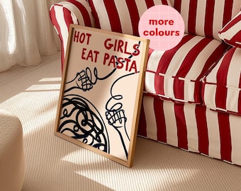 Op de afbeelding: Een ingelijst print met een roze achtergrond en zwart-witte lijnkunst van twee handen die een bord pasta vasthouden. De tekst "HOT GIRLS EAT PASTA" staat in het zwart op de print.