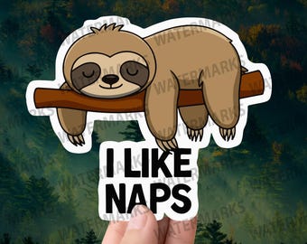 May include: A brown sloth with closed eyes is sleeping on a branch. The sloth is hanging upside down. The text "I LIKE NAPS" is written below the sloth.