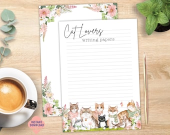 May include: Two sheets of white lined writing paper featuring a floral border at the top and a group of illustrated cats at the bottom. The text Cat Lovers writing papers is printed at the top of the front sheet in black script and typewriter font.