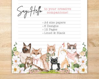 May include: A sheet of A4 stationery featuring horizontal lines and a bottom border of six illustrated cats surrounded by white and pink flowers. The text reads: Say Hello to your creative companions! A4 size papers, 6 Designs, 12 Pages, Lined & Blank.