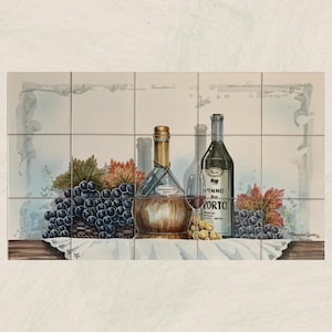 May include: A still life painting of two bottles of wine, a glass of wine, and grapes. The bottles are on a table with a white tablecloth. The painting is on a tiled background.