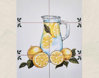 May include: A set of six white ceramic tiles featuring a watercolor illustration of a glass pitcher filled with lemonade and lemon slices. Whole and sliced lemons with green leaves are arranged around the pitcher. Black leaf accents are in the corners.