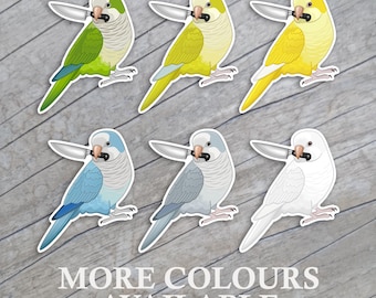 May include: A collection of six stickers featuring cartoon parrots, each holding a knife in its beak. The parrots come in various colors, including green, yellow, blue, gray, and white. The text "MORE COLORS AVAILABLE" is at the bottom.
