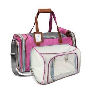 May include: Pink and gray travel carrier for pets with a mesh window and a zippered pocket on the front. The carrier has a brown leather handle and a shoulder strap.