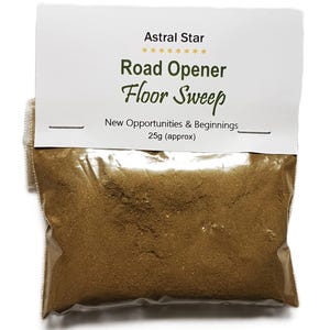 May include: A transparent plastic bag containing a brown powder, labelled "Road Opener Floor Sweep" with the text "Astral Star" above. The bag contains approximately 25g of product and is sealed with a white label.
