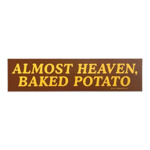 May include: A rectangular brown sticker with the text "ALMOST HEAVEN, BAKED POTATO" in yellow, bold letters. The website "holy-smokes.co" is printed in small white letters at the bottom.