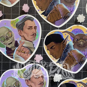 Autocollant à paillettes arc-en-ciel Dragon Age Veilguard Emmrich et Manfred, Davrin et Assan