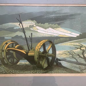 May include: A vintage print depicting a farm scene at night. A large, yellow and black tractor is in the foreground, with rolling hills and a starry sky in the background. The print has a muted color palette of greens, blues, and yellows.