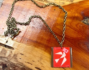 Il ciondolo con francobollo "Per sempre".