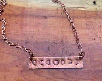 Hand stamped moon phase pendant on copper