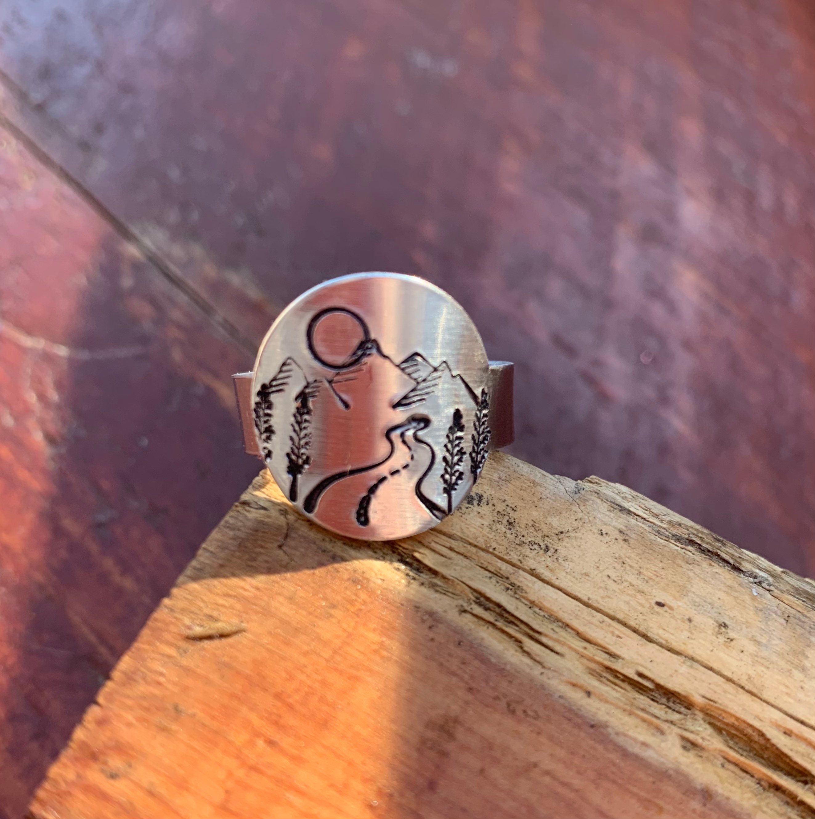 Custom hand stamped mountain scene on adjustable aluminum band