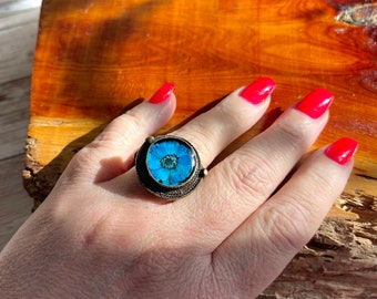 Dried flower ring in unique brass bezel