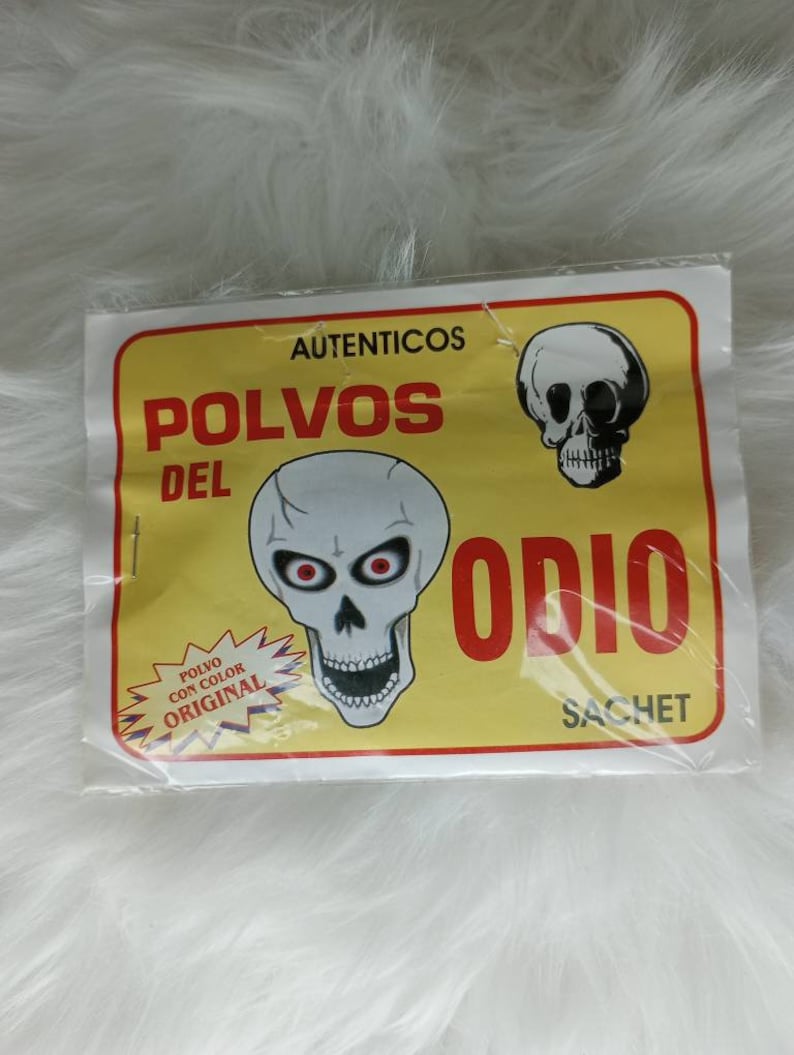 May include: A yellow and white package with a skull graphic and the text "AUTENTICOS POLVOS DEL ODIO SACHET". The text "POLVO CON COLOR ORIGINAL" is also visible on the package.