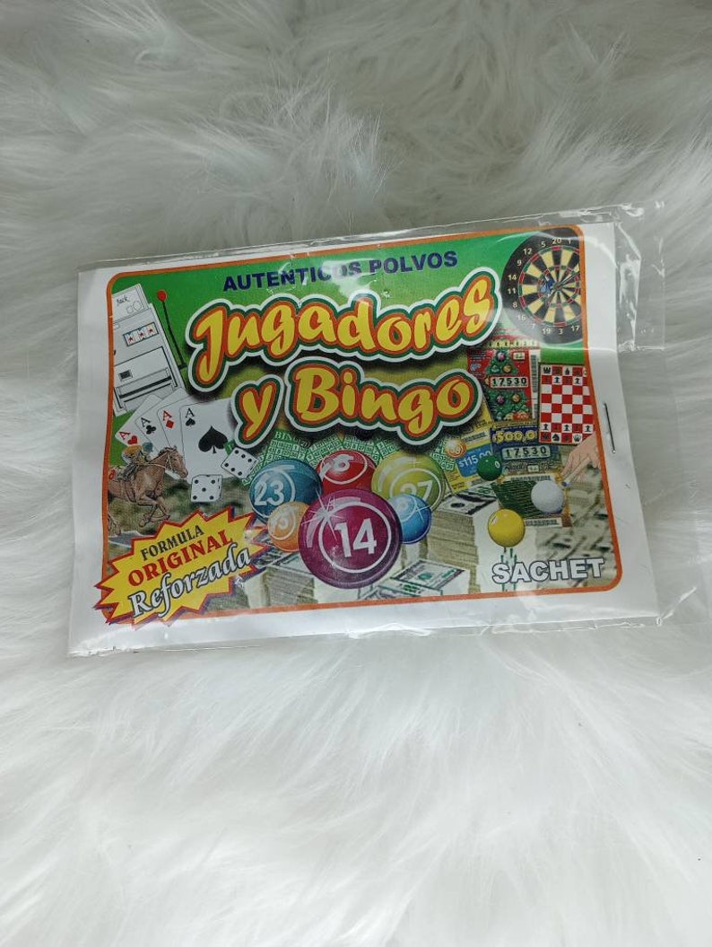 May include: A white and green packet with the text "AUTENTICOS POLVOS Jugadores y Bingo" and a picture of a bingo ball with the number 14. The packet also has the text "FORMULA ORIGINAL Reforzada" and "SACHET".