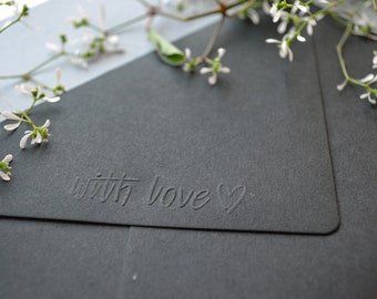 Envelope black with embossed "with love" lettering