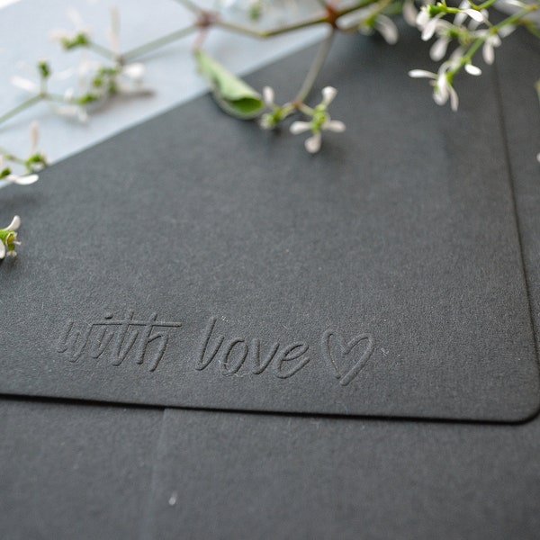 Envelope black with embossed "with love" lettering