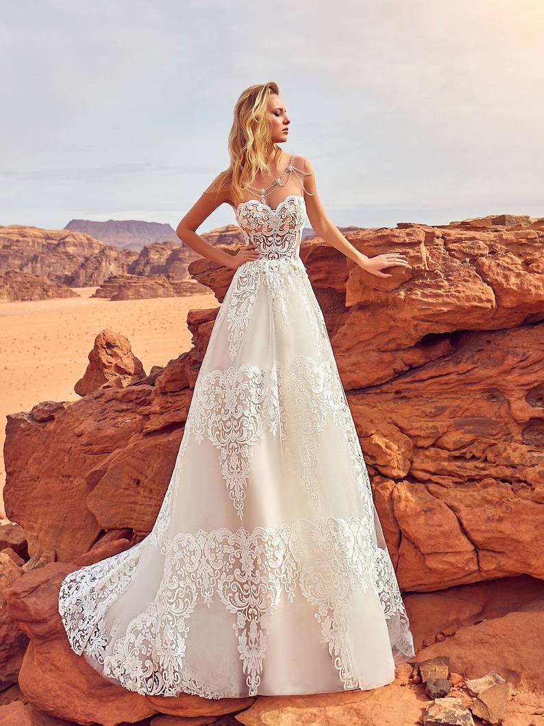 Beautiful wedding dress with big lace elements Romantic image 0