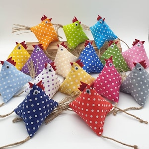 May include: A collection of 16 handmade fabric chickens in various colors and patterns, including polka dots, stripes, and solids. The chickens are all sewn with a red beak and black eyes.