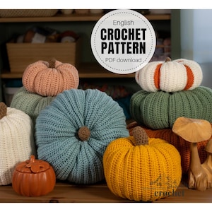 May include: A collection of crocheted pumpkins in various colours including blue, yellow, green, white, and peach, featuring ribbed textures and brown stems. A circular label reads English CROCHET PATTERN PDF download, and text at the bottom reads crochet.