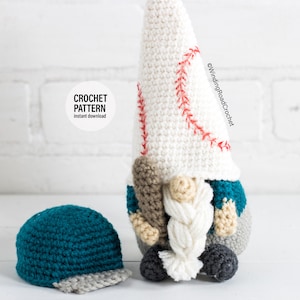 May include: Crochet pattern for a baseball gnome with a white hat, teal shirt, and grey trousers. The gnome is holding a baseball bat and has a white braided beard. The pattern is available for instant download. A teal and grey baseball cap is also included in the image.