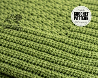 May include: Close-up of a green crocheted fabric with a textured stitch pattern. The fabric is made with a soft yarn and has a subtle sheen. The image includes the text "English Crochet Pattern PDF download."