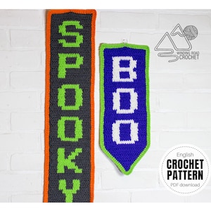May include: Two crocheted banners, one with the word "SPOOKY" in green and black yarn, and the other with the word "BOO" in white and purple yarn. The banners are hanging on a white brick wall. The text "English Crochet Pattern PDF download" is visible in the bottom right corner.