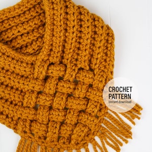 May include: A mustard yellow crochet scarf with fringe. The scarf is made with a textured stitch pattern. The text "CROCHET PATTERN instant download" is on a white circle in the lower right corner of the image.