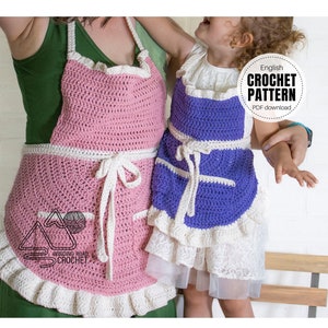 May include: A crochet pattern for an adult apron in pink and white and a child's apron in purple and white. The pattern is available as a PDF download. The text on the pattern says "English Crochet Pattern PDF download."