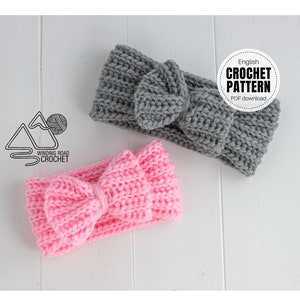 May include: Two crocheted headbands with bows. One headband is gray and the other is pink. The headbands are on a white wooden surface. English Crochet Pattern PDF download.