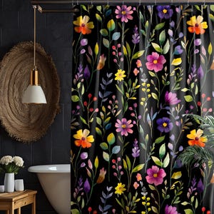May include: Black shower curtain with a watercolor floral pattern featuring yellow, pink, purple, and orange flowers on a black background.