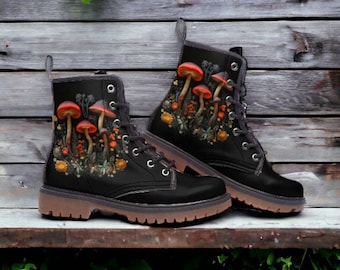 May include: A pair of black leather boots featuring a mushroom and floral design. The boots have laces and a chunky sole.
