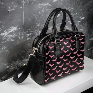 Pink and black purse sales