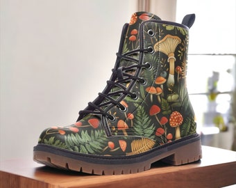 May include: Black leather lace-up boots with a green, orange, and brown mushroom and fern pattern.