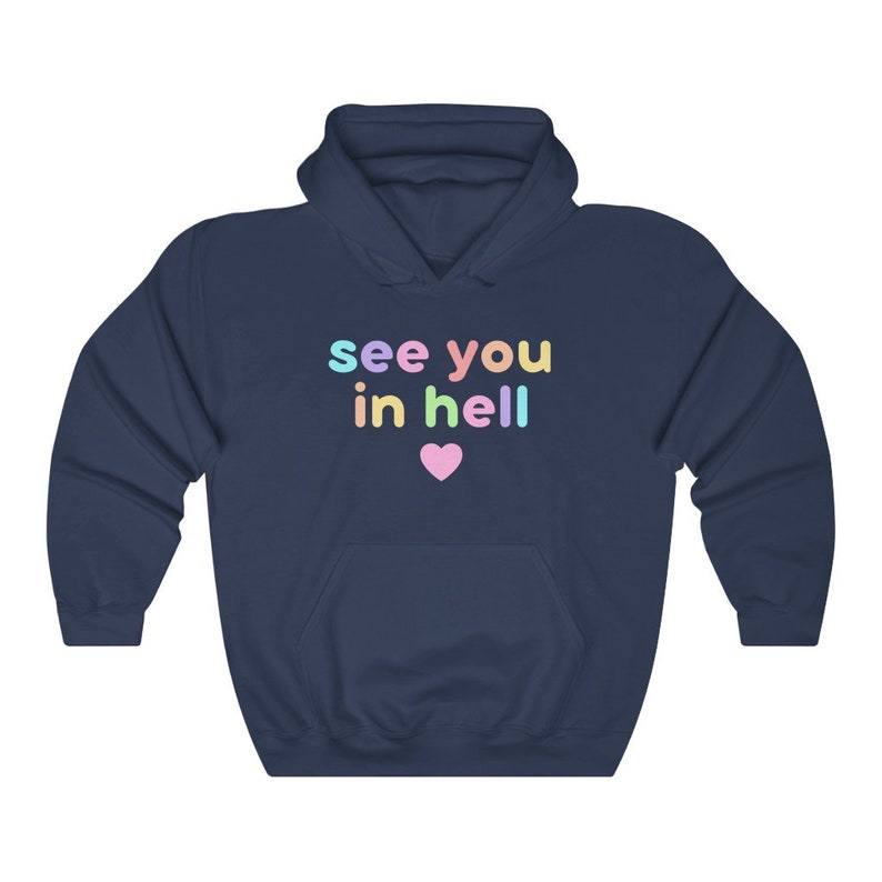 May include: Navy blue hoodie with the text "see you in hell" in rainbow colours and a pink heart.