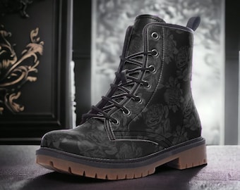 May include: Black leather lace-up boots with a floral pattern. The boots have a round toe and a thick rubber sole.