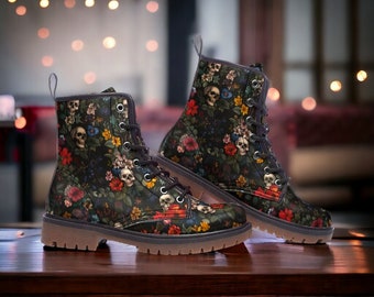 May include: Black leather boots with a floral and skull print. The boots have a lace-up closure and a chunky sole.