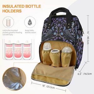 May include: A black and purple floral patterned diaper bag with insulated bottle holders. The bag has a zippered top closure, adjustable straps, and a large main compartment. The bag also has a smaller front pocket and two side pockets. The bag is 16 inches tall, 10 inches wide, and 6.5 inches deep.