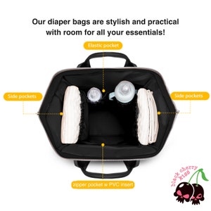 May include: A black diaper bag with multiple pockets, including side pockets, an elastic pocket, and a zippered pocket with a PVC insert. The bag is open and shows the interior, which is lined with a black mesh material. The bag is filled with various baby items, such as diapers, wipes, and bottles.