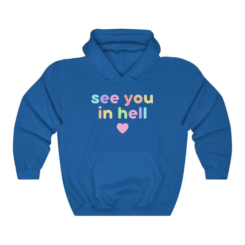 May include: A royal blue hoodie with a white heart and the text "see you in hell" in rainbow colours.