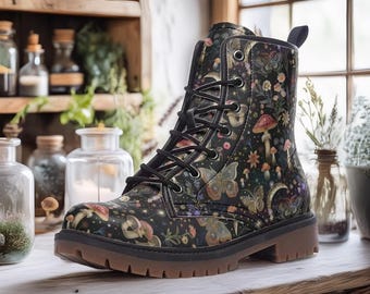 May include: Black leather lace-up boots with a colorful print of mushrooms, butterflies, and other nature-inspired elements. The boots have a chunky sole and a rounded toe.