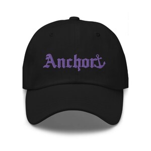 May include: Black baseball cap with a purple embroidered anchor and the word "Anchor" in a gothic font.