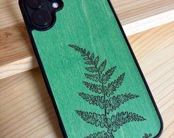 May include: A green phone case with a black border and a black camera cutout. The back features a detailed black line drawing of a fern leaf and the word alto printed in small black letters near the bottom right corner.
