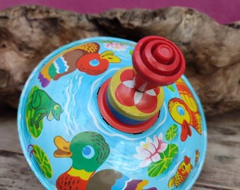 Old metallic spinning top Vintage fashion toys Colourful spinning top Animals of the lake whirligig Retro gig Toy spinner Collectible toys