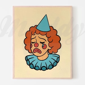 Puede incluir: Una impresión enmarcada con una ilustración de dibujos animados de un payaso triste. El payaso tiene cabello rizado naranja, un gorro de fiesta azul y un cuello con volantes. Se ven lágrimas rojas y rubor en la cara del payaso, sobre un fondo neutro.