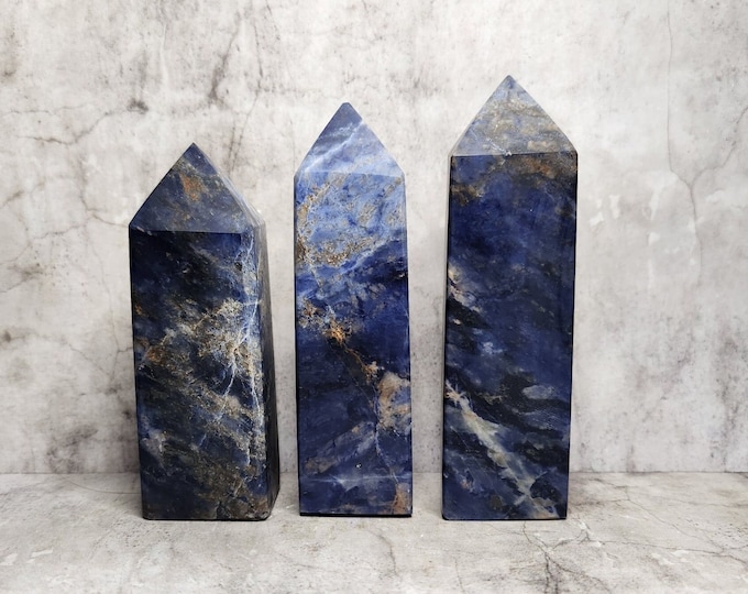 Sodalite: Deep blue with white veins, radiates a calming energy and is associated with intuition, clear thinking and inner peace