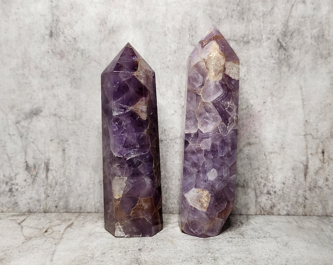 Chevron Amethyst: Unleashes intuition, stimulates spiritual growth. Promotes clear thinking, emotional balance. Provides dynamic energy.