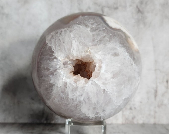 Geode agate ball with sparkling crystal core. Brings protection, balance and a calm appearance to any room or setting.
