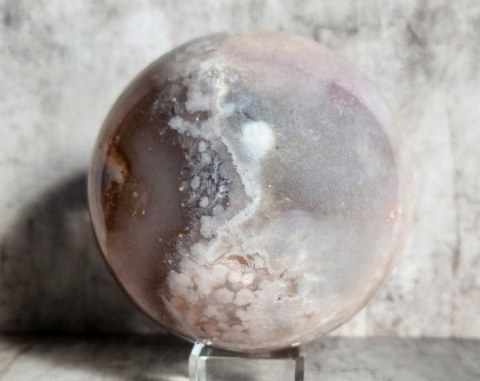 Flower agate ball with druzy inclusions: unique combination of structure and calm tones. Ideal as crystal decoration or spiritual tool.